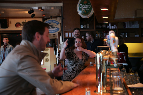 Two characters drinking at the bar