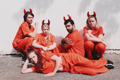 Cast of Villains posing for camera